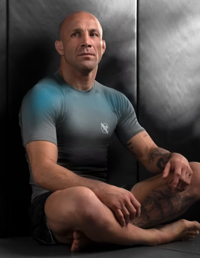 A man wearing hayabusa grey/aqua hayabusa fusion short sleeve rash guard