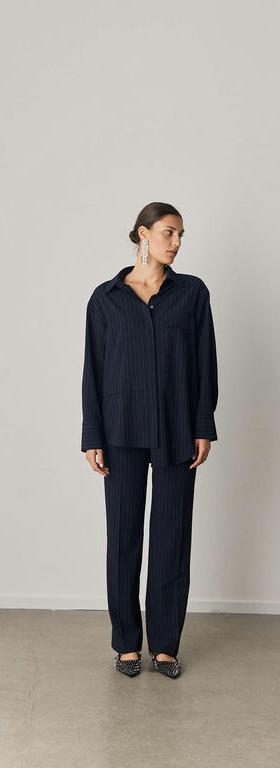A woman wearing Iben soho shirt