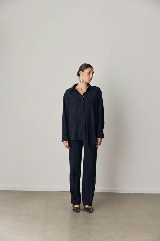 A woman wearing Iben soho shirt