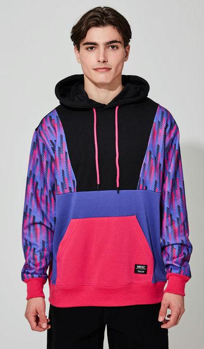 A man wearing WeSC multi racing stripes hoodie