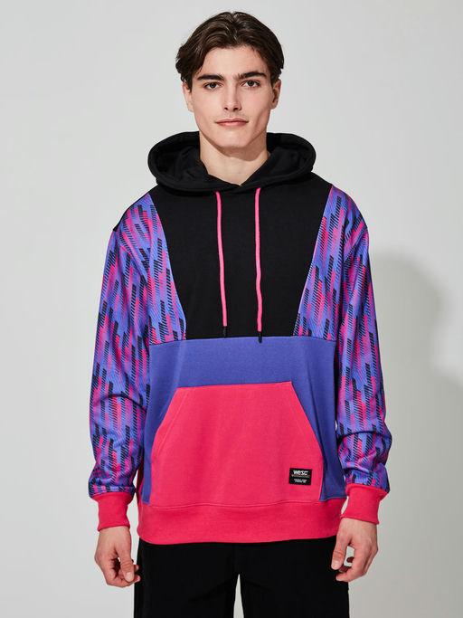 A man wearing WeSC multi racing stripes hoodie