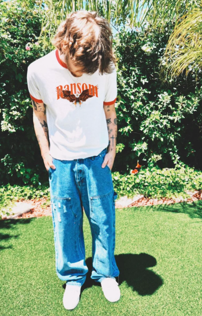 A man wearing Ransom screamin eagle ringer tee