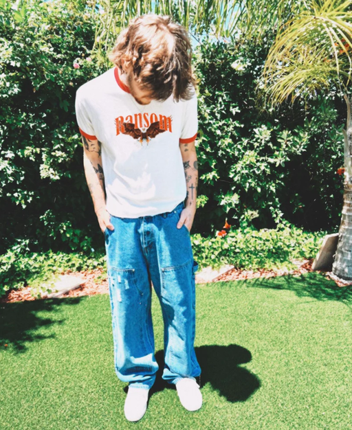 A man wearing Ransom screamin eagle ringer tee