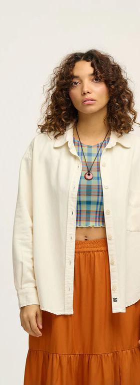 A woman wearing Lucy & Yak lenny shirt: organic cotton - ecru