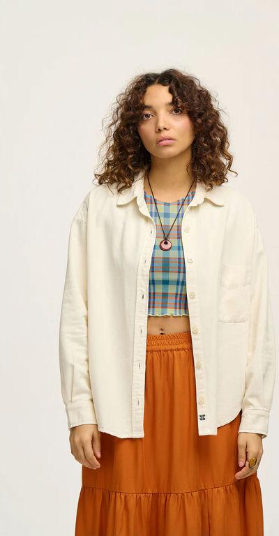 A woman wearing Lucy & Yak lenny shirt: organic cotton - ecru