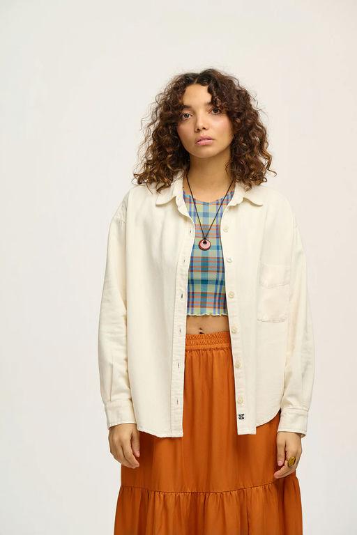 A woman wearing Lucy & Yak lenny shirt: organic cotton - ecru