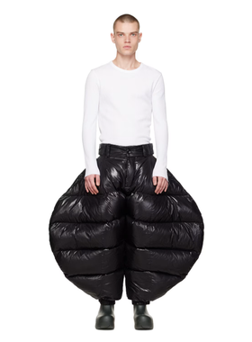 A man wearing Chen Peng black greatest showman trousers