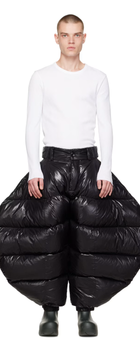 A man wearing Chen Peng black greatest showman trousers