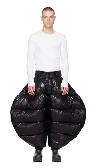 A man wearing Chen Peng black greatest showman trousers
