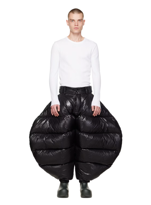 A man wearing Chen Peng black greatest showman trousers