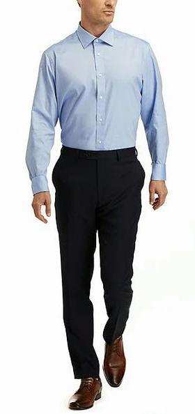A man wearing Hickey Freeman modern fit spread collar solid dress shirt - blue