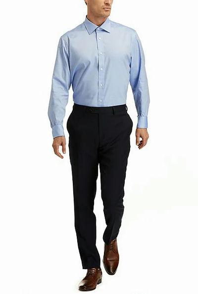 A man wearing Hickey Freeman modern fit spread collar solid dress shirt - blue