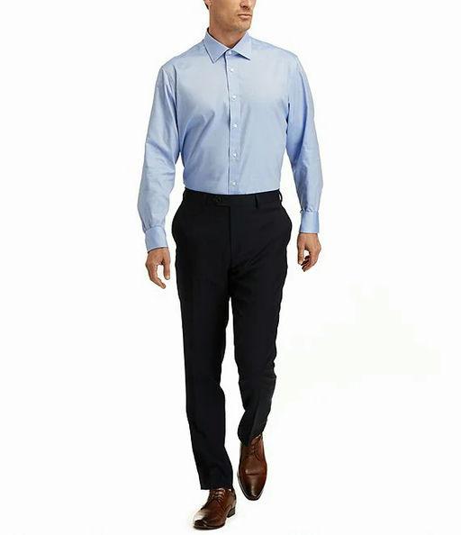 A man wearing Hickey Freeman modern fit spread collar solid dress shirt - blue