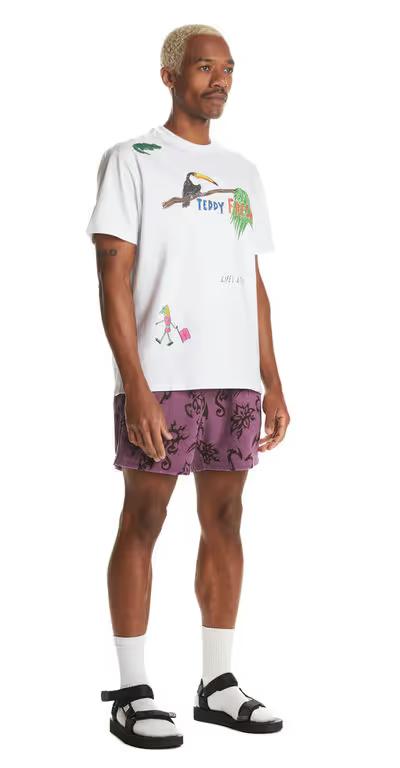 A man wearing Teddy Fresh white iguana tee