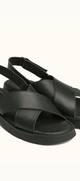 An image of Kleman black leather cross-strap sandals