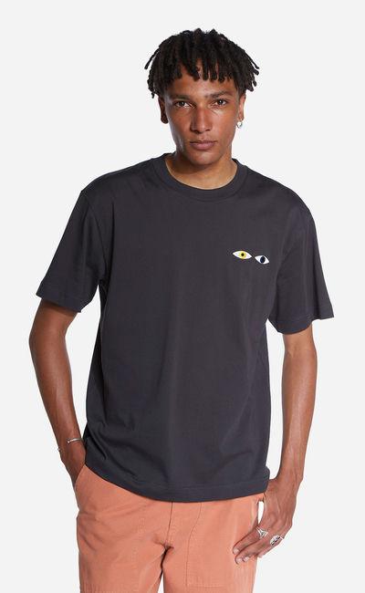 A man wearing Olow oversized black different tee shirt