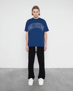 A man wearing Cole Buxton varsity arch outline navy t-shirt