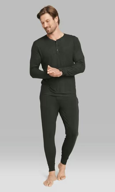 A man wearing Tommy John charcoal heather downtime henley pajama tee