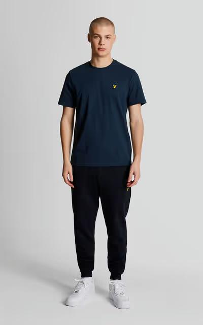 A man wearing lyle and scott plain navy t-shirt