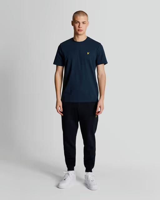 A man wearing lyle and scott plain navy t-shirt