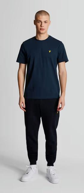 A man wearing lyle and scott plain navy t-shirt