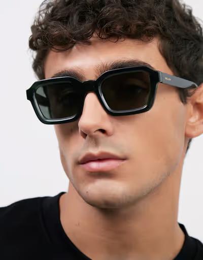 A man wearing Meller fog olive sunglass