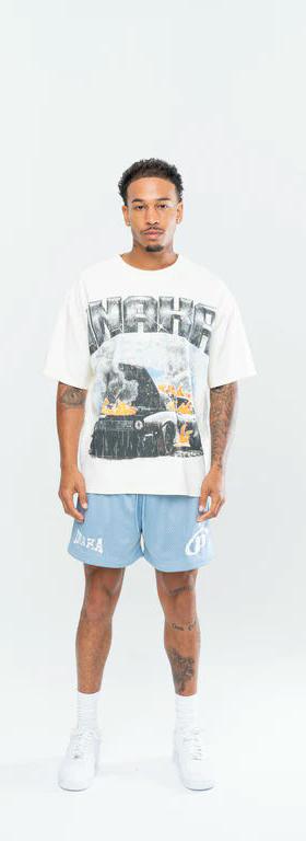 A man wearing Inaka Power fury road tee - cream