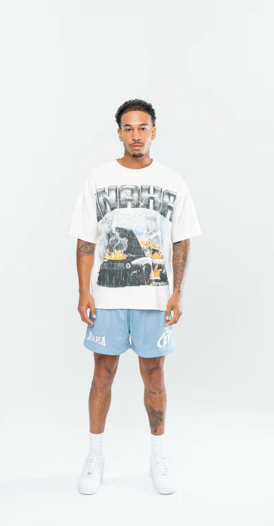 A man wearing Inaka Power fury road tee - cream