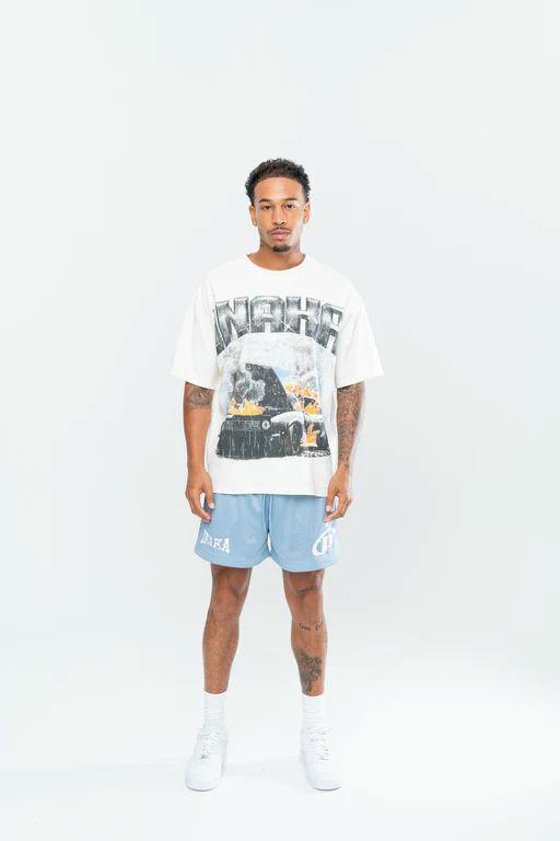 A man wearing Inaka Power fury road tee - cream