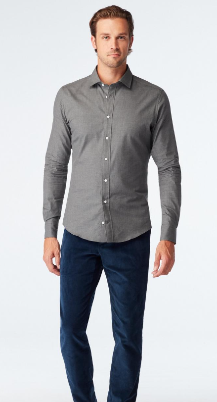 A man wearing Indochino dilham melange charcoal casual shirt