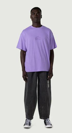 A man wearing Honor the Gift embroidery logo t-shirt - purple