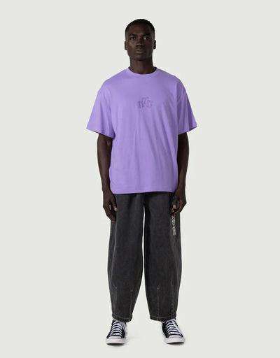 A man wearing Honor the Gift embroidery logo t-shirt - purple