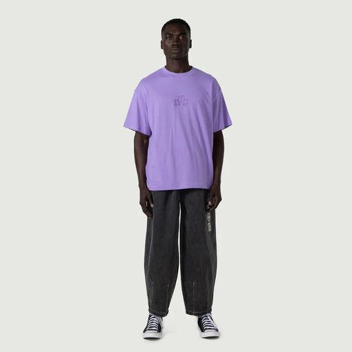 A man wearing Honor the Gift embroidery logo t-shirt - purple