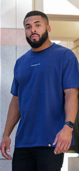 A man wearing YouthLA essential jacked tees - blue