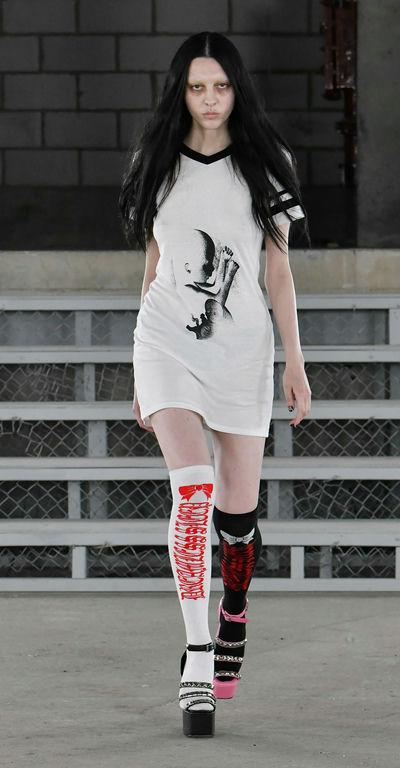 A woman wearing Ashley Williams baby varsity t dress
