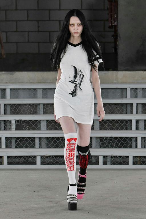 A woman wearing Ashley Williams baby varsity t dress