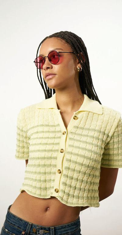 A woman wearing Akila Glasses black/rose club 57 x keith haring sunglass
