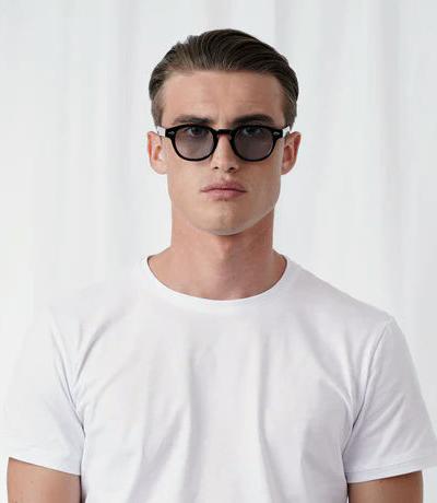 A man wearing Explicit Poets tinted johnny sunglass
