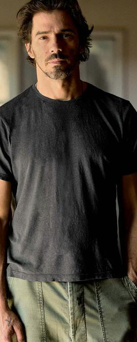 A man wearing imogene and willie cotton hemp crew in faded black t-shirt