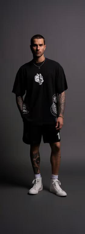 A man wearing Darc Sport perfect form "Premium" oversized tee in black