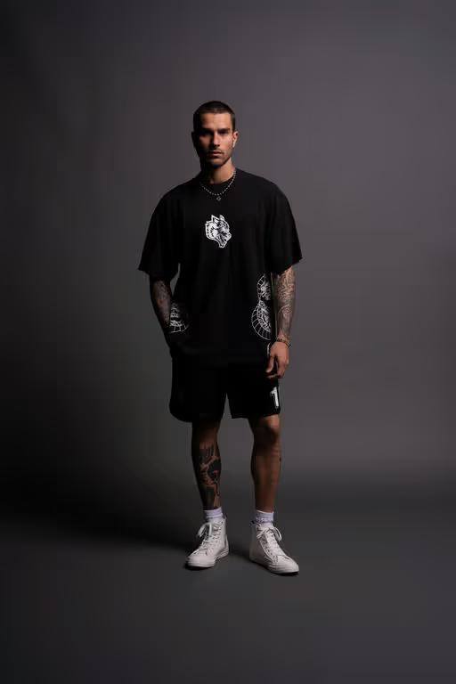 A man wearing Darc Sport perfect form "Premium" oversized tee in black
