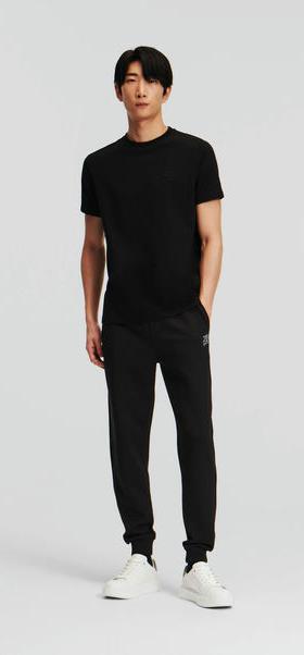 A man wearing Karl Lagerfeld black t-shirt