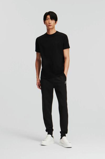 A man wearing Karl Lagerfeld black t-shirt