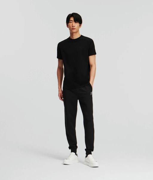 A man wearing Karl Lagerfeld black t-shirt