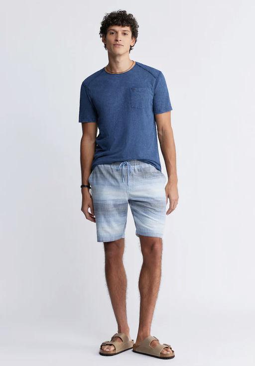 A man wearing Buffalo kamizo men's pocket t-shirt in whale blue