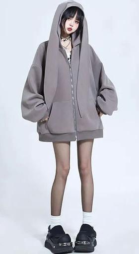 A woman wearing Modakawa long bunny ears pocket oversize zipper hooded grey sweatshirt