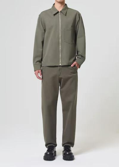 A man wearing AGOLDE moss color vinson chino shirt