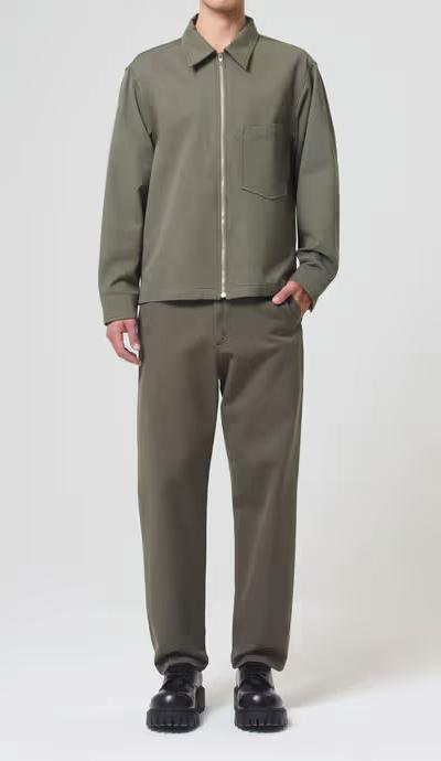 A man wearing AGOLDE moss color vinson chino shirt