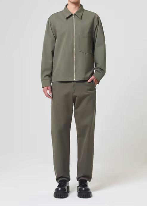 A man wearing AGOLDE moss color vinson chino shirt