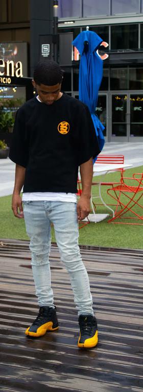 A man wearing Bands Clothing black t-shirt